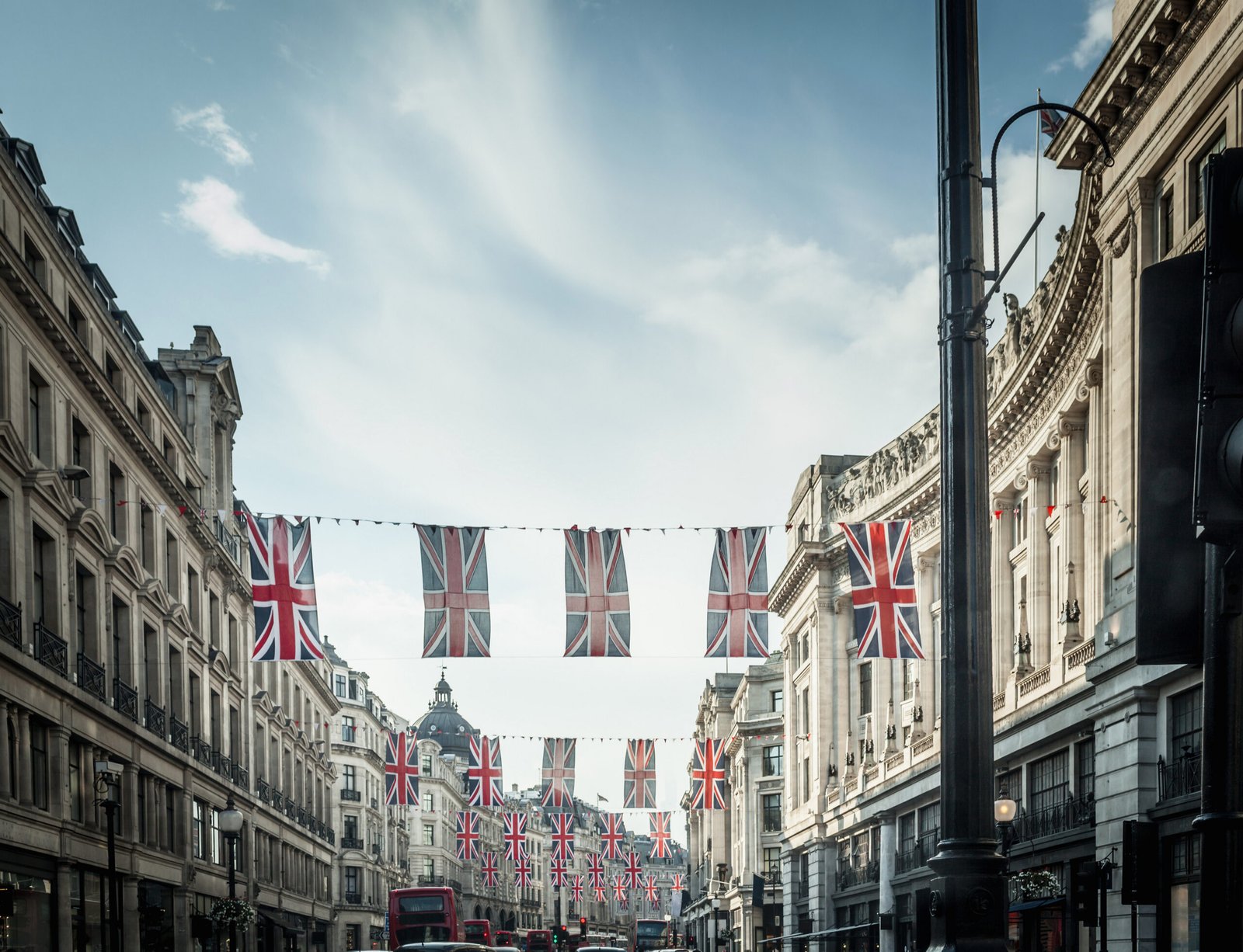 City street adorned with British flags, symbolizing travel opportunities to the UK through ETA visa services